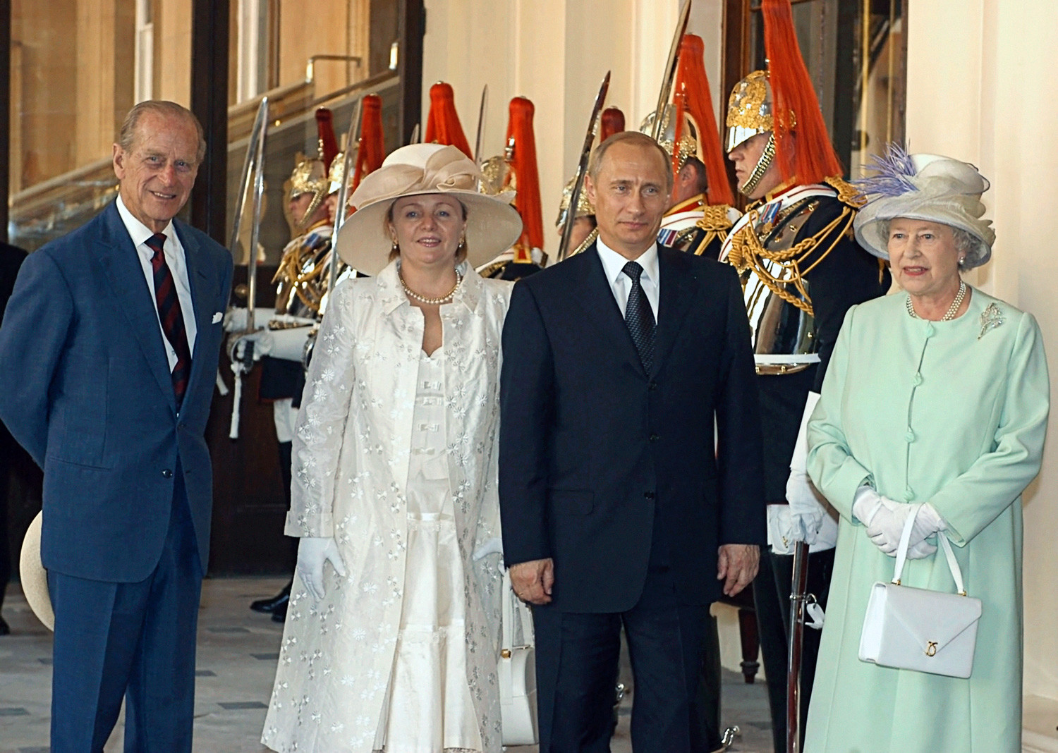 Vladimir Putin and Lyudmila Putina with Queen of Great Britain Elizabeth II and Duke of Edinburgh Philip in London.