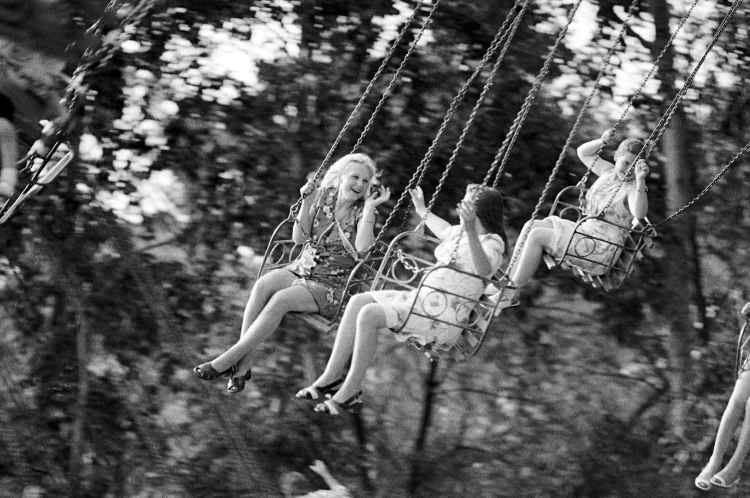 Children are swinging in Khabarovsk park.