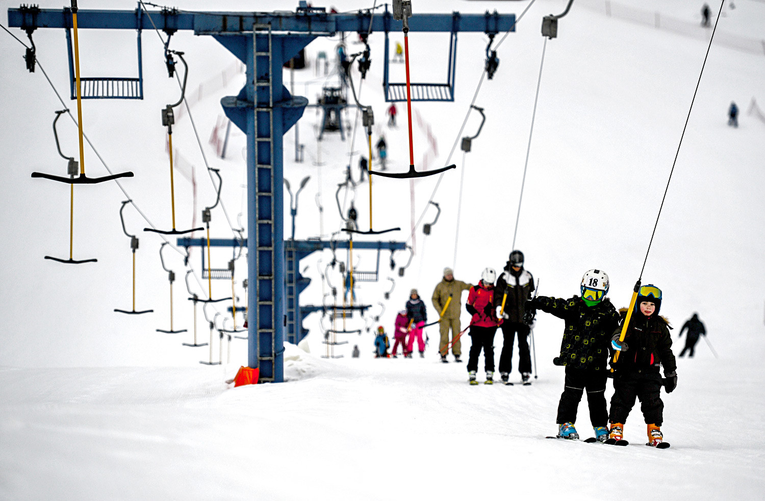 Children use a ski lift in Volen Sports Park (Yahroma) near Moscow.