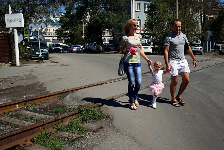 A family walk near the train station in the eastern Russian city of Vladivostok.