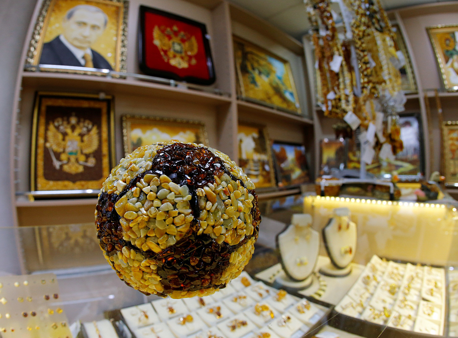 A soccer ball (yes, there’s a portrait of Vladimir Putin on the wall, also made with amber)