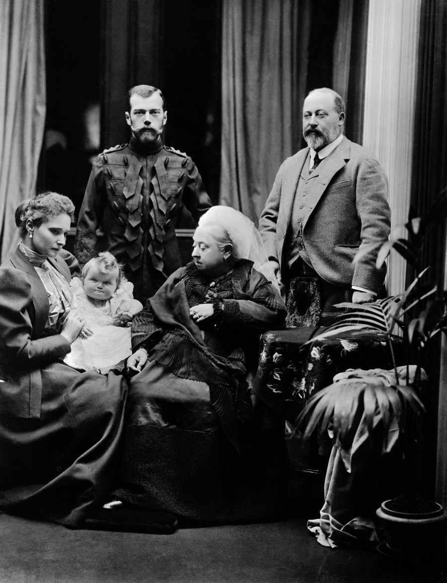 Nicholas II (note his sharp outfit) and Alexandra Fedorovna visit Queen Victoria (Alexandra's grandmother). From left to right: Alexandra Fedorovna; the infant Grand Duchess Olga; Nicholas II of Russia; Queen Victoria of England; Albert Edward, Prince of Wales.