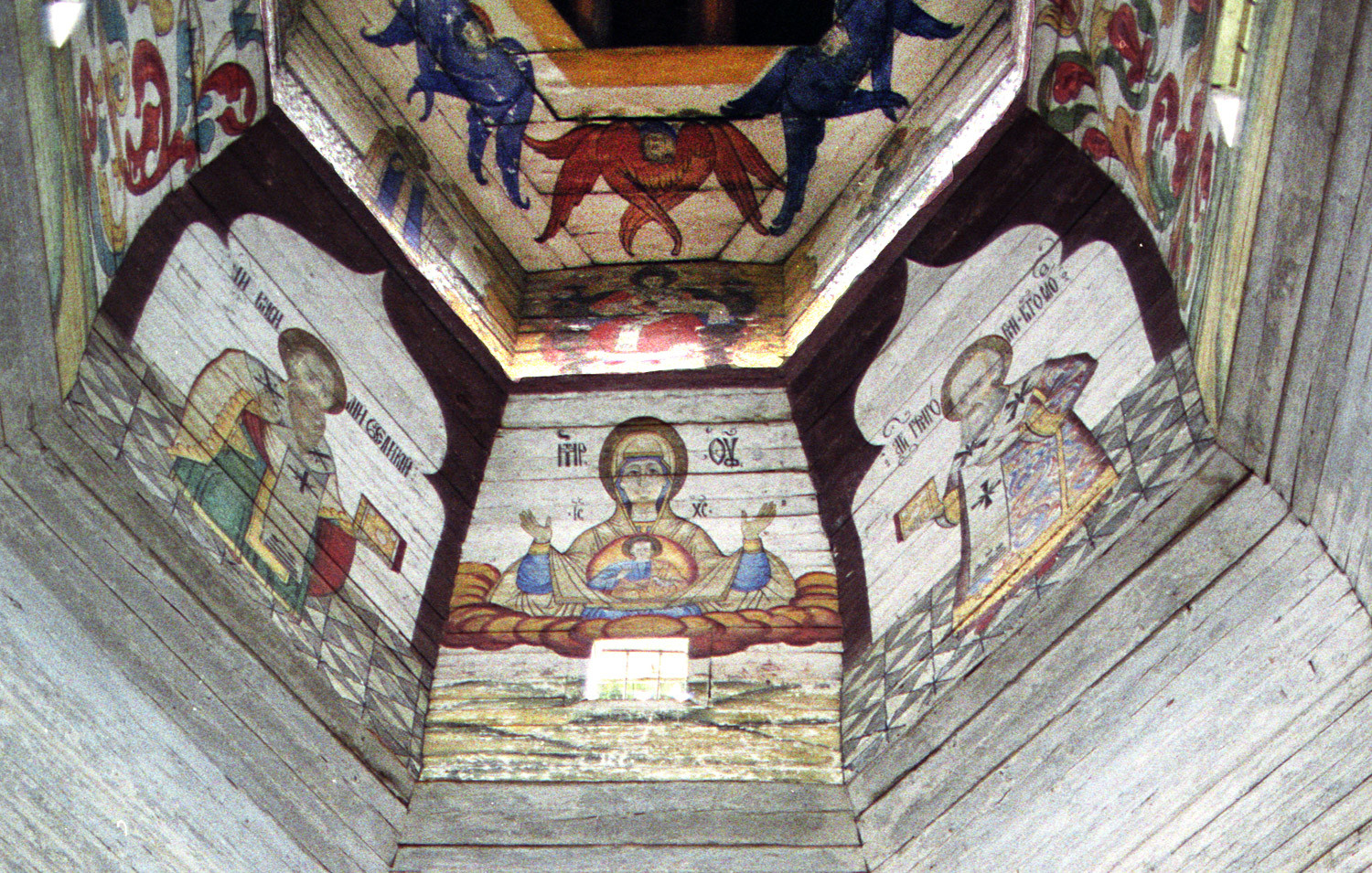 Church of the Tikhvin Icon of the Virgin (Old Church of the Ascension). View of paintings on east wall of upper tier. From left: St. Basil the Great, Virgin Mary of the Sign, St. Gregory the Theologian. Aug. 19, 2006.