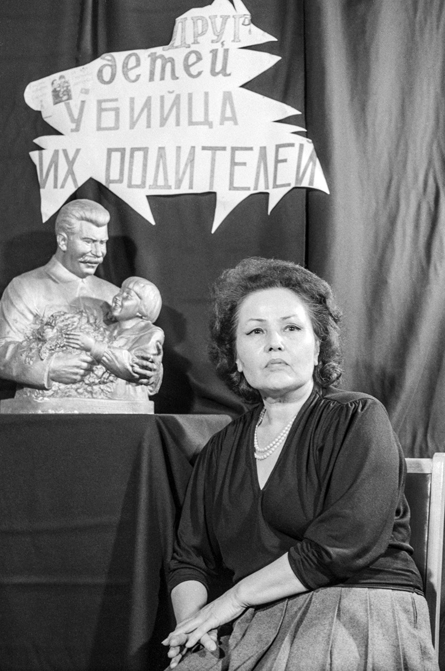 Engelsina Markizova in 1989. The poster behind her says sarcastically: 