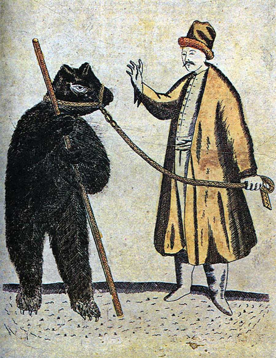  Um domador e seu urso no século 19. Domínio público