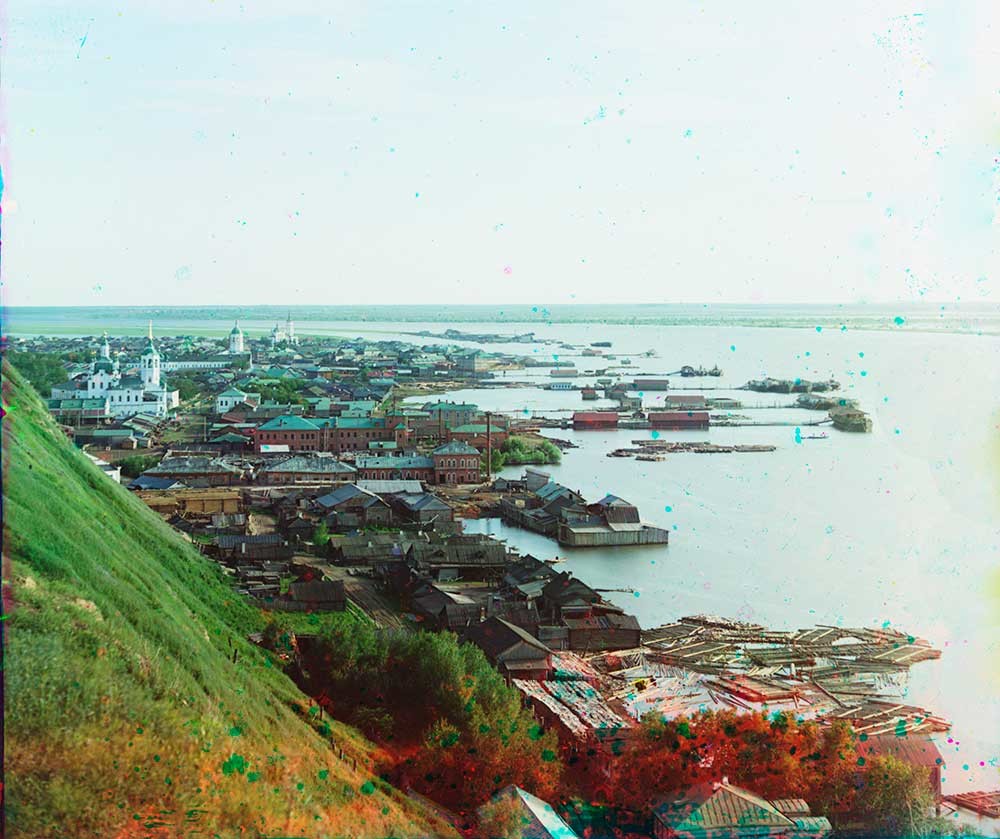 Tobolsk Lower Town. View south from kremlin bluff. From left: Church of Sts. Zacharias&Elizabeth, Znamensky Monastery & bell tower, Church of Elevation of the Cross, Irtysh River with docks. June 1912.