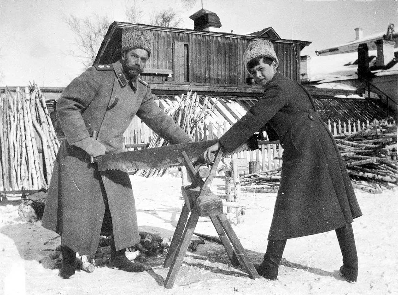 Tsarevich Alexei Nikolaevich and Tsar Nicholas II sawing wood at Tobolsk 