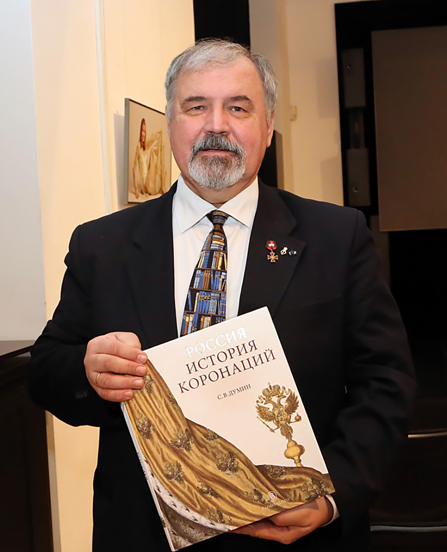 Stanislav Dumin, Chief Herold for the Assembly of the Russian Nobility, holding his book 