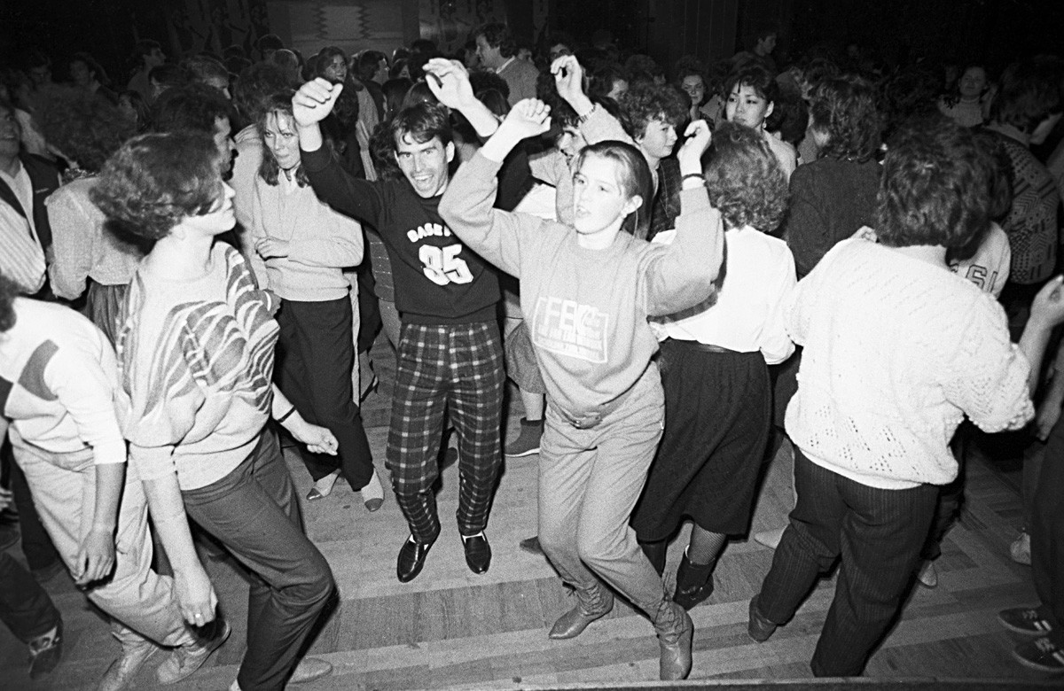 Young people dance  at a disco night at the Gorky Park Moscow
