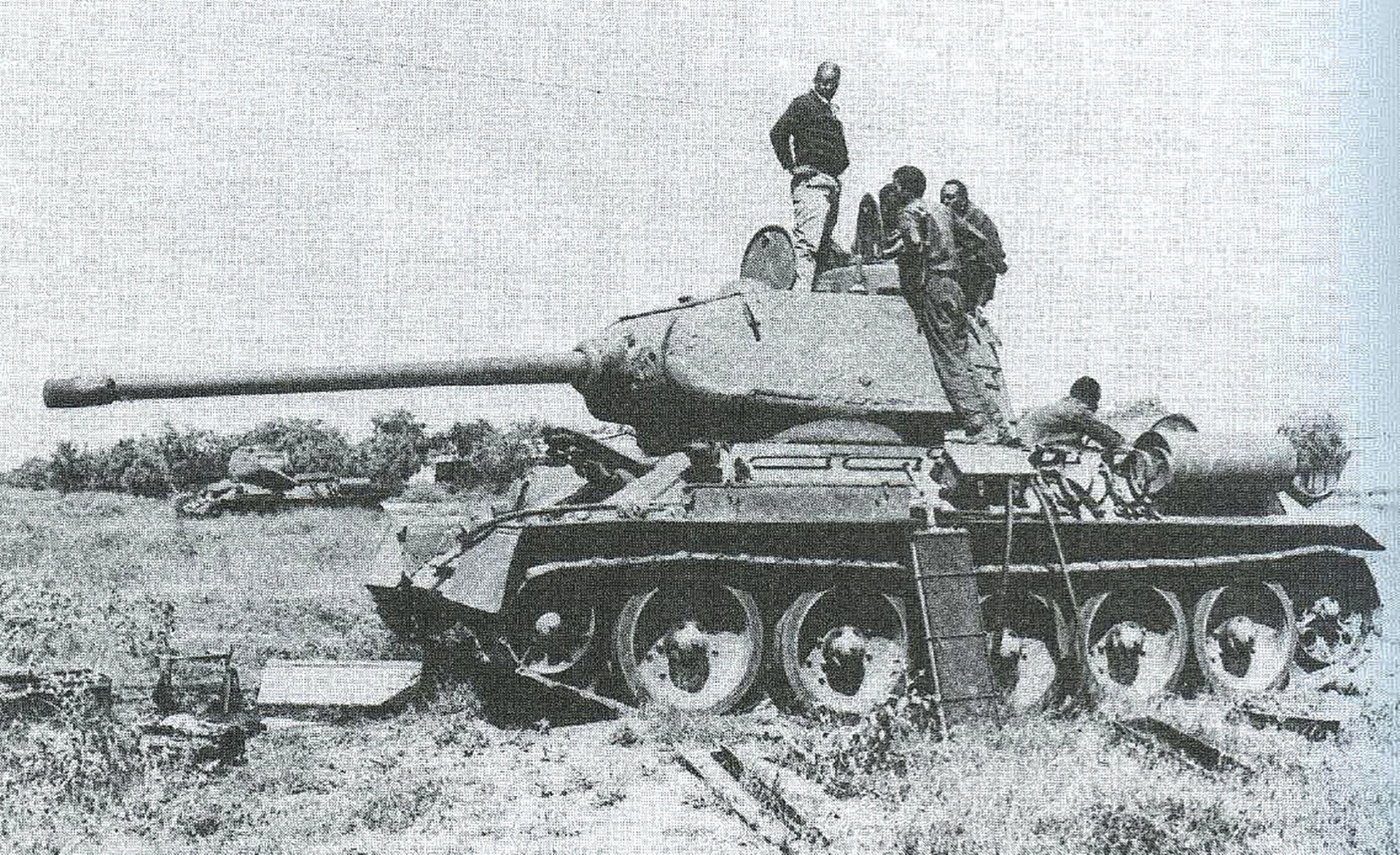 A heavily damaged Somali National Army T-34 going through repairs.