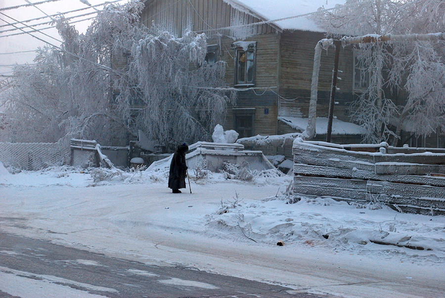 A woman walks along a street in a frosty January 2013.