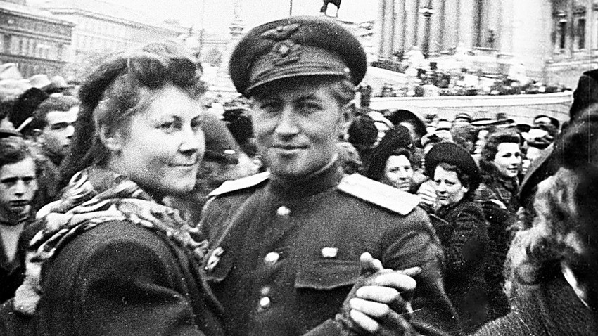An Austrian woman and a Soviet officer are dancing in the streets of Vienna after the defeat of Nazi Germany