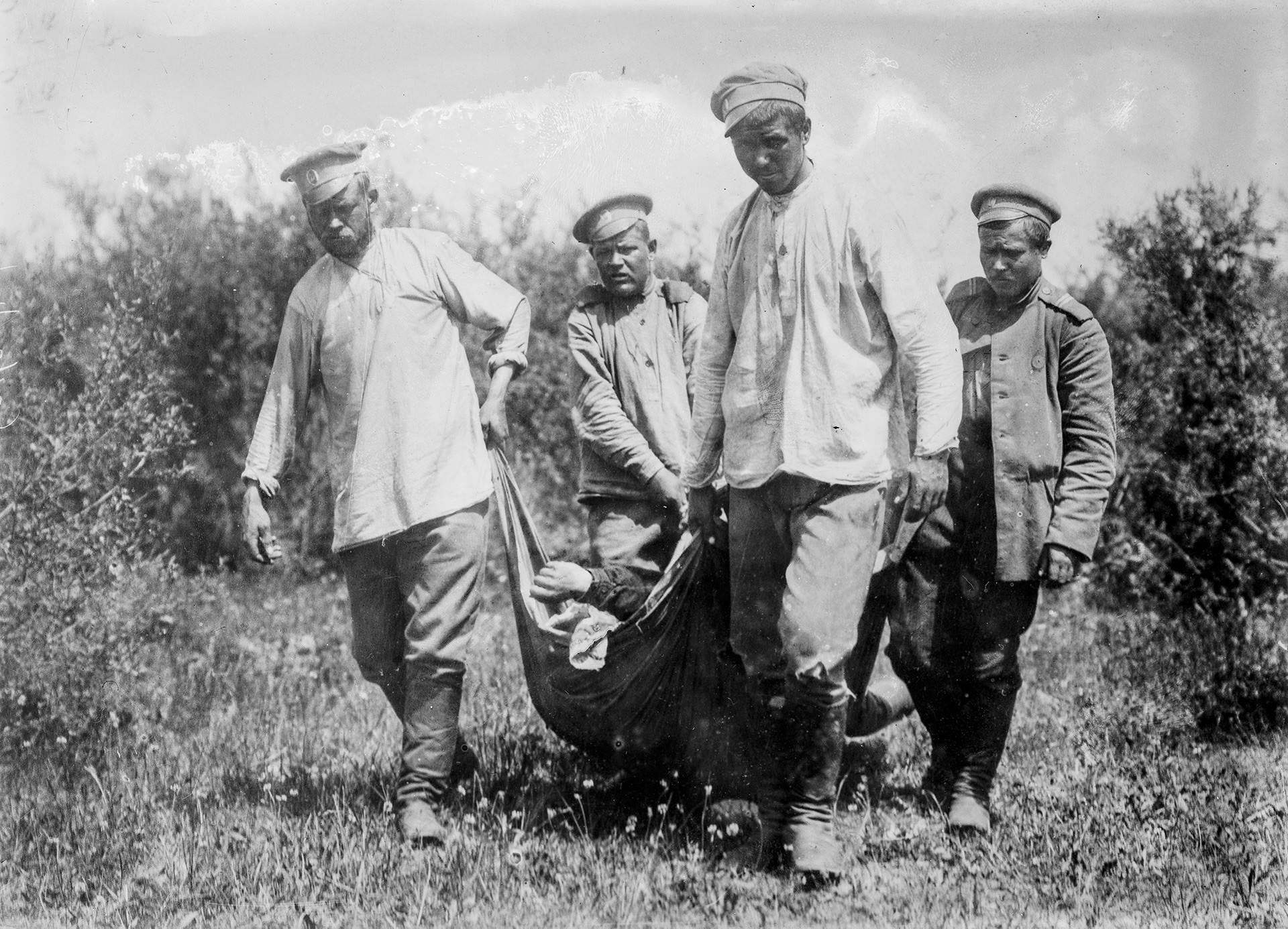 Russian soldiers collect their dead from the battlefield during World War I