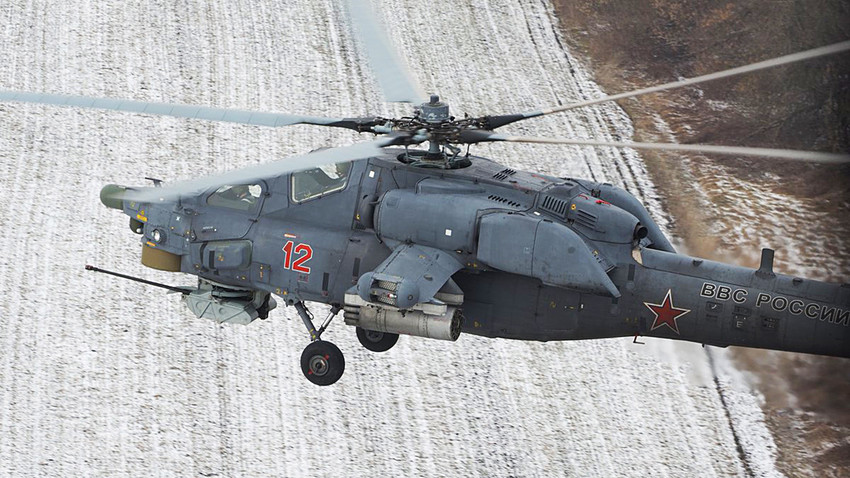The crews of the attack helicopters Mi-28N in the Stavropol region practicing elements of piloting in difficult weather conditions