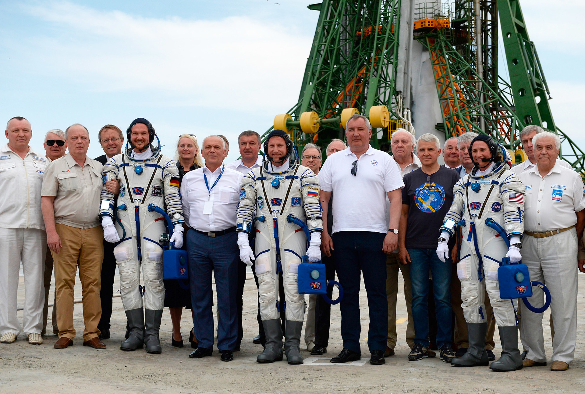Roscosmos Head Dmitry Rogozin and members of ISS Expedition 56/57 crew pose for a group photo before the launch of the Soyuz-FG launch vehicle with the Soyuz MS-09 manned spacecraft from the First Gagaringky Launch Pad at Baikonur, June 2018