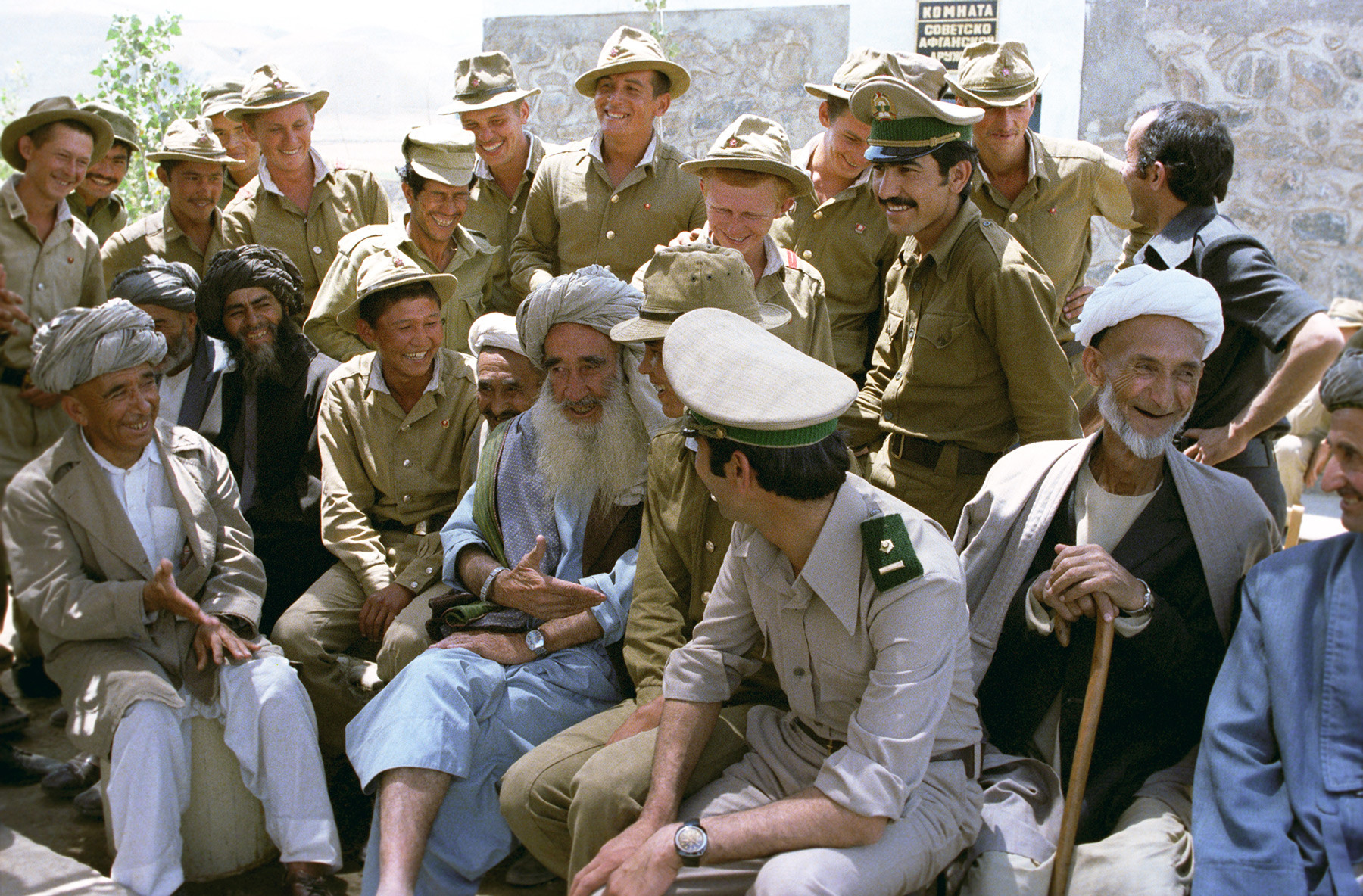 Soviet soldiers communicate with Afghan residents