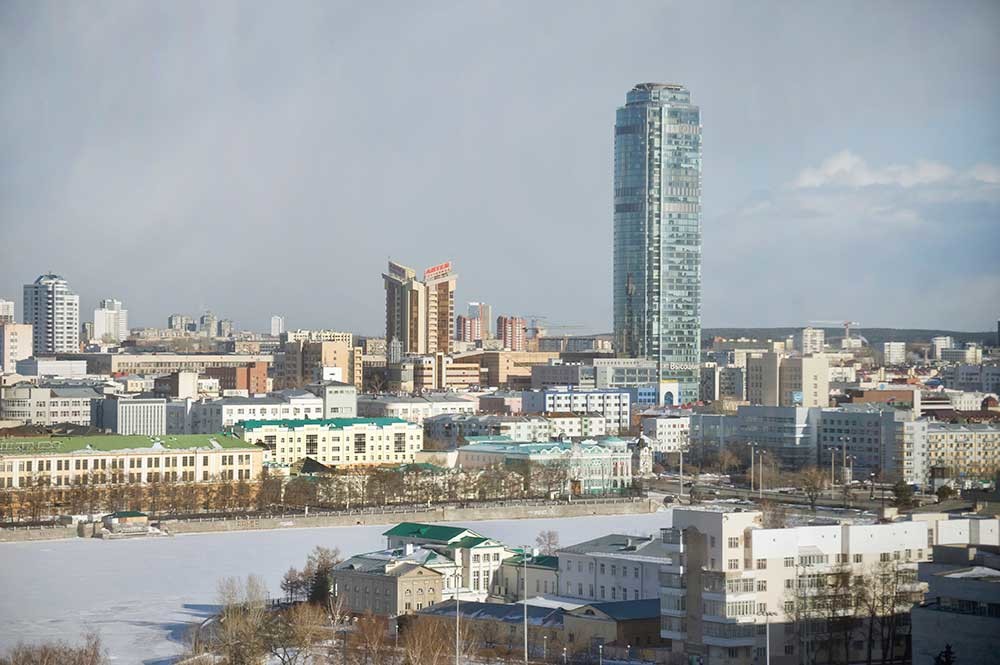 Yekaterinburg panorama. Center: Vysotsky Tower. Below: City Pond with Chapel of St. Catherine & Sevastyanov House (beneath tower). Lower left on pond: Back facade of residence of Urals Mining Director. April 1, 2017.
