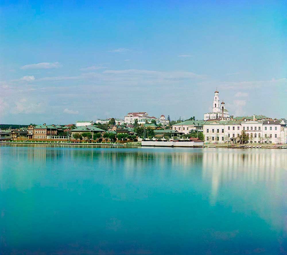 View across City Pond toward Ascension Hill. From left:  Rastorguev-Kharitonov Mansion, bell tower & Church of Ascension. Right foreground: State Gold Refinery. Summer 1909.