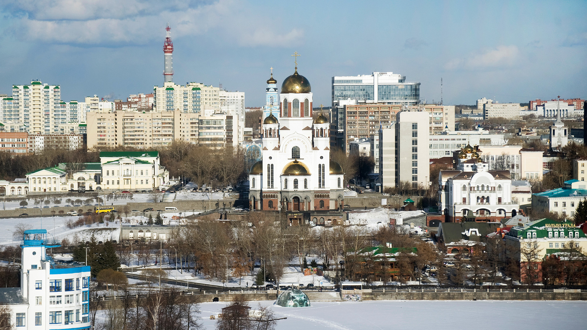 Yekaterinburg. West view of Ascension Hill across frozen City Pond. From left:  Rastorguev-Kharitonov Mansion, bell tower of Ascension Church, Church of All Saints Resplendent in the Russian Land, Church of St. Nicholas at the Patriarchal Legation. April 1, 2017.