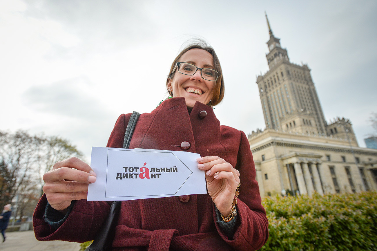 A woman participating in the Totalny Diktankt (Total Dictation) linguistic exercise in Warsaw, Poland.