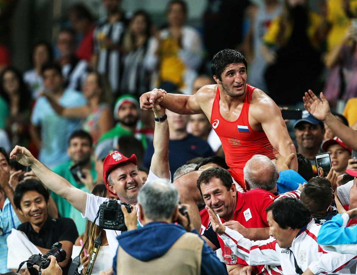 bdulrashid Sadulaev of Russia (red) celebrates his victory over Selim Yasar (not seen) of Turkey during the Men's Freestyle 86kg Gold Medal bout of the Rio 2016 Olympic Games at Carioca Arena 2 in Rio de Janeiro, Brazil on August 20, 2016