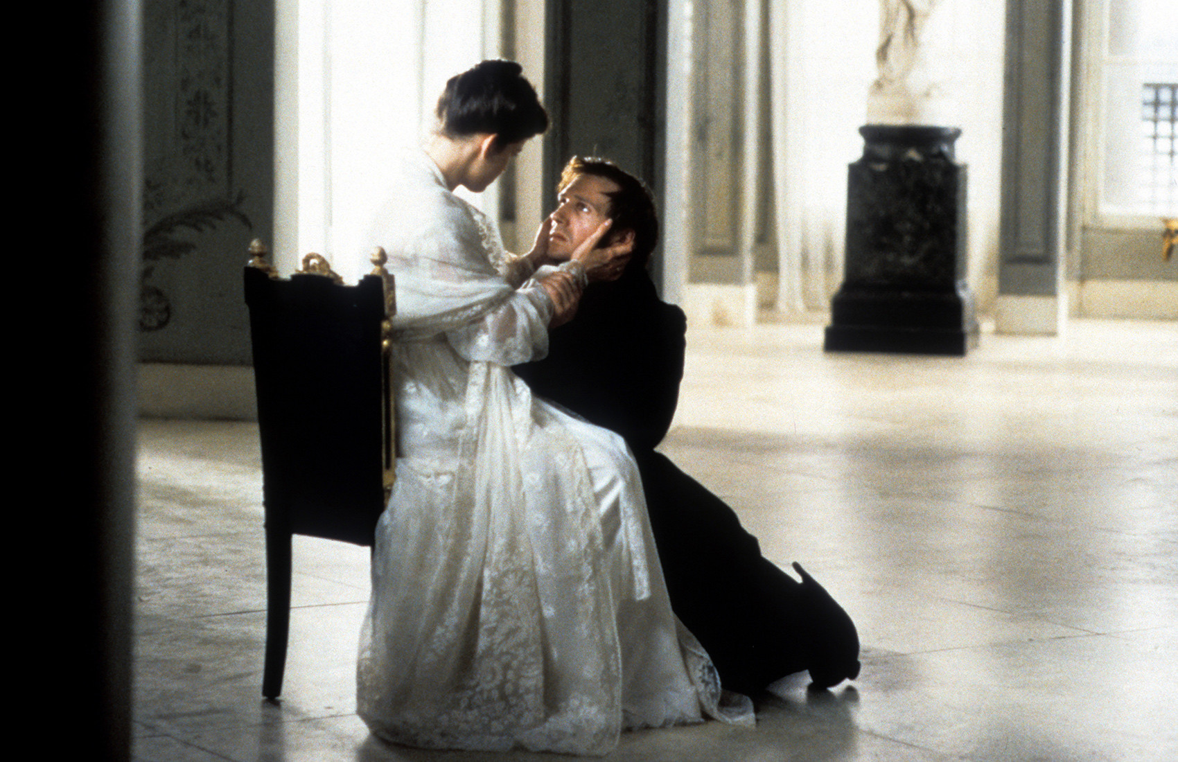 Ralph Fiennes as Eugene Onegin, on his knees.