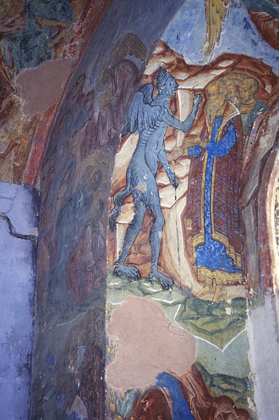 St. Kirill Belozersk Monastery. Dormition Cathedral, north gallery. North wall window embrasure with fresco of devil making mark of Antichrist on forehead of adherents. April 1, 2001.