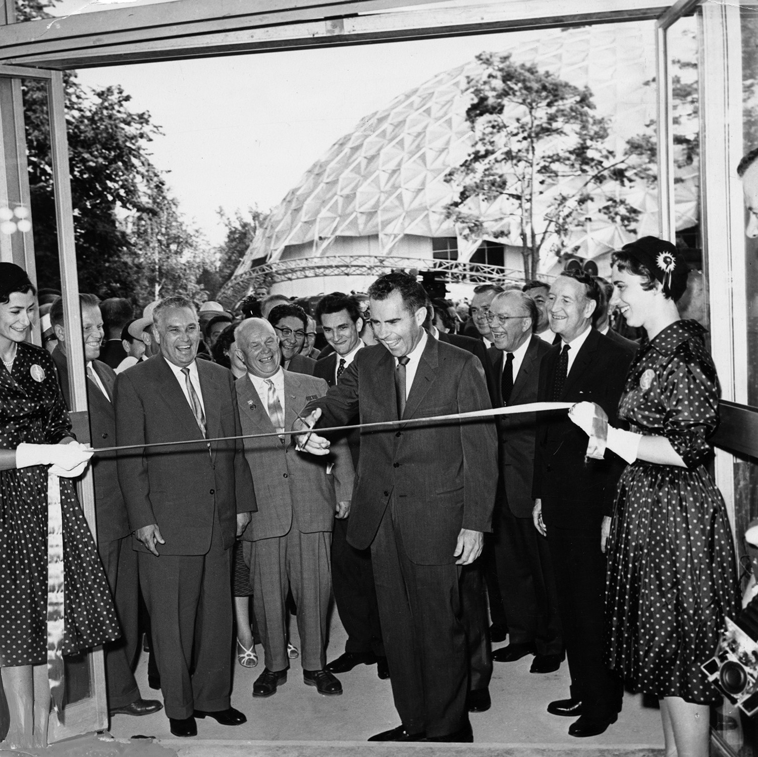 Richard Nixon cuts the ribbon, officially opening the exhibit.