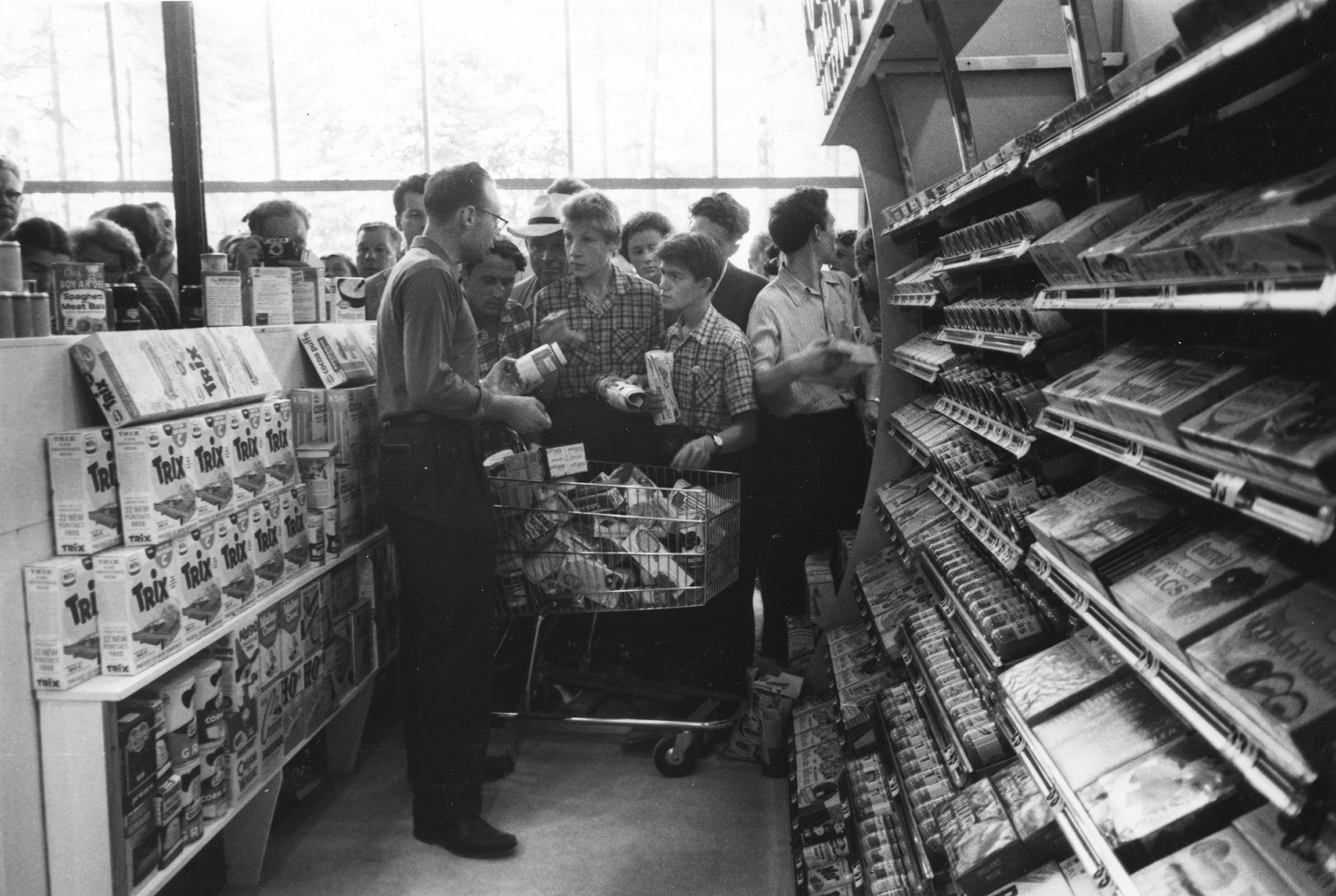 Soviet observers are being shown what a  supermarket looks like.
