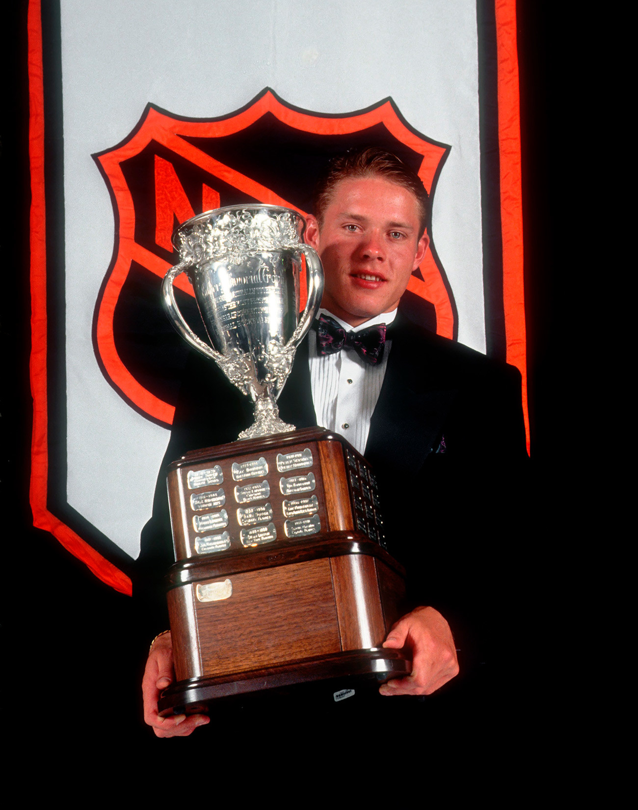 Pavel Bure of the Vancouver Canucks poses after winning the Calder Trophy named for the top rookie of the year.