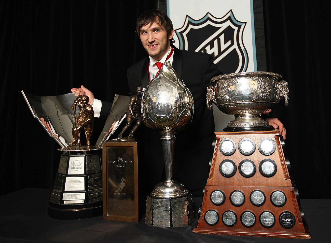 Alex Ovechkin of the Washington Capitals wins the, from left to right, Maurice 'Rocket' Richard Trophy, Lester B. Pearson Award, Hart Memorial Trophy at the 2008 NHL awards at the Elgin Theatre in Toronto.