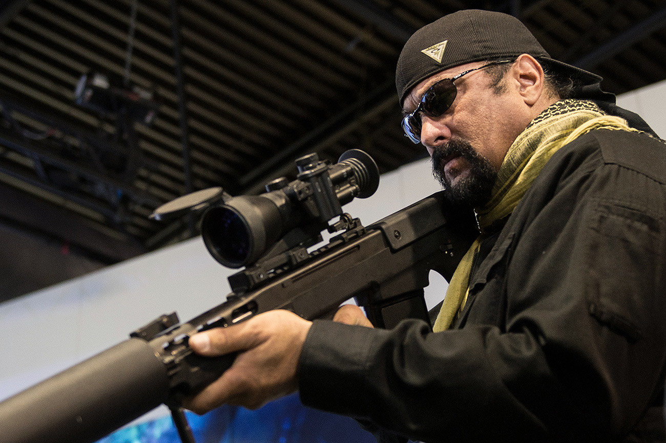 Actor Steven Seagal checking an AK during a military exhibition in Russia in 2006. 