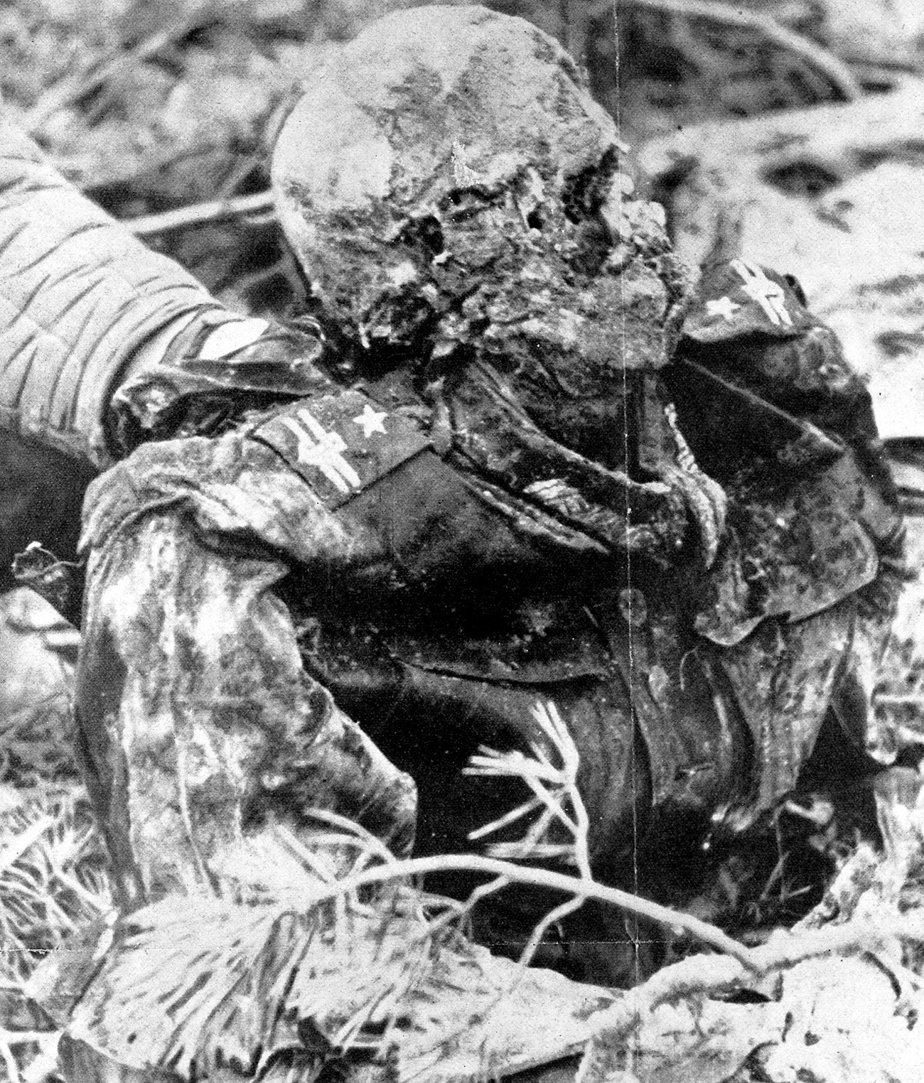 The corpse of a Polish commander (major) is found in some pits, discovered by the Germans in April, 1943 in the forest of Katyn ( Byelorussia).