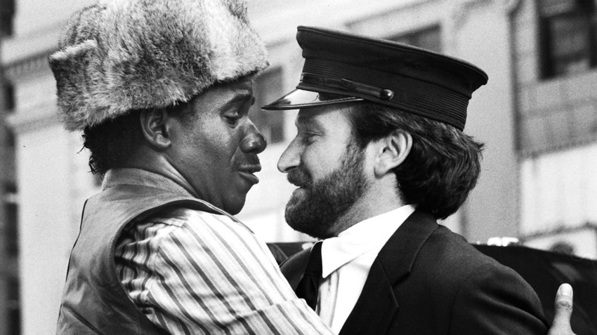 Actor Robin Williams as Vladimir Ivanoff and Cleavant Derricks as Lionel Witherspoon on the set of the Columbia Pictures movie " Moscow on the Hudson" in 1984