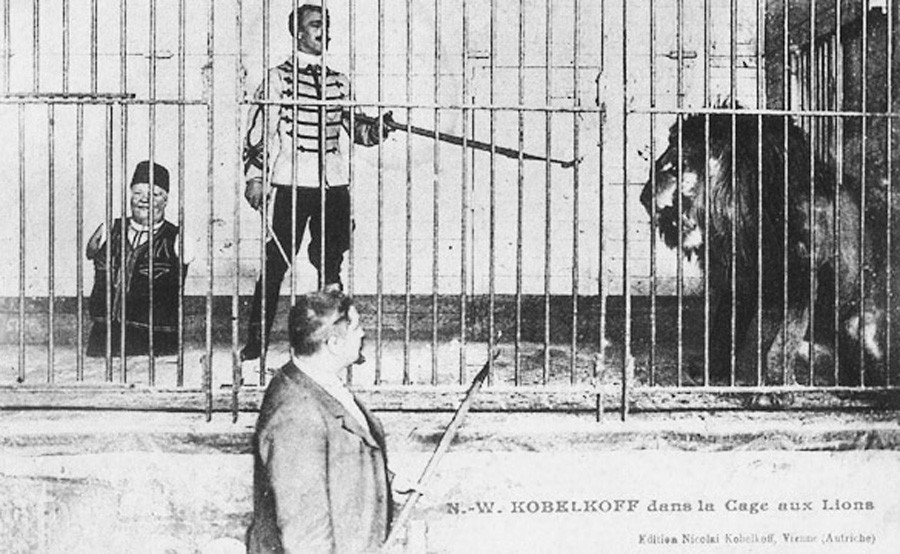Nikolai Kobelkoff and his son in a lion's cage