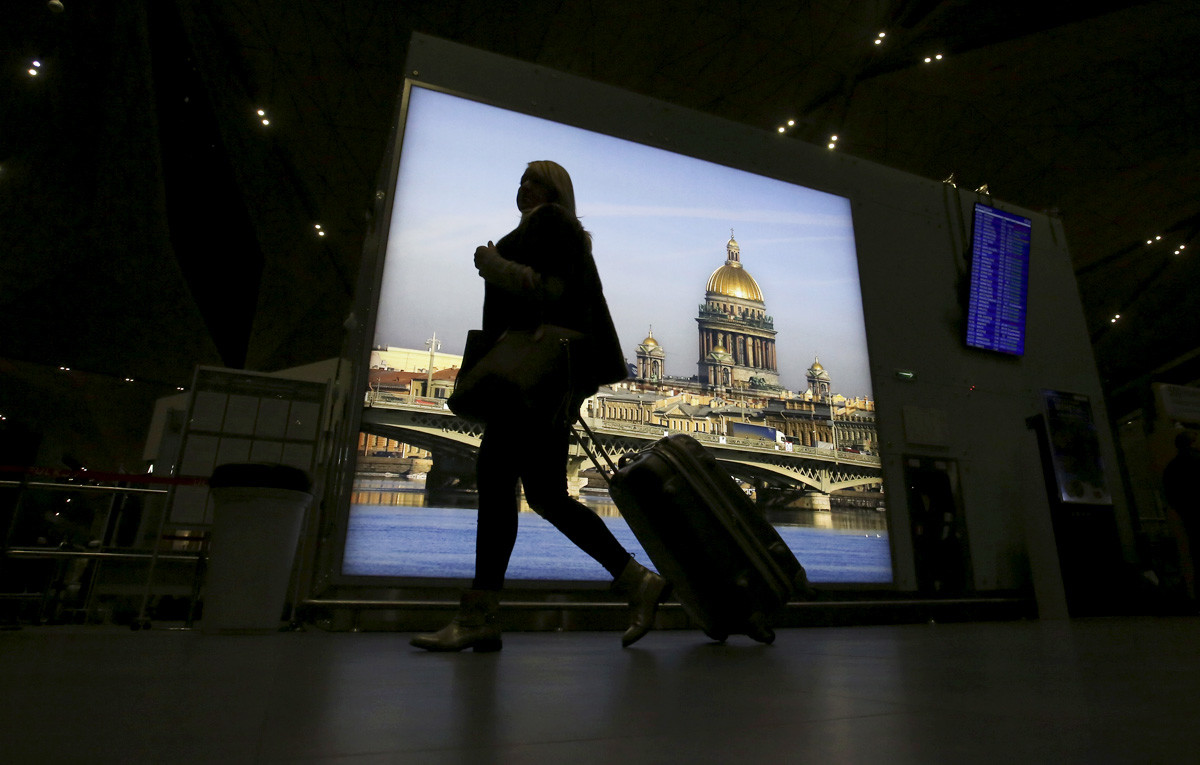 A passenger with luggage walks at Pulkovo airport outside St. Petersburg