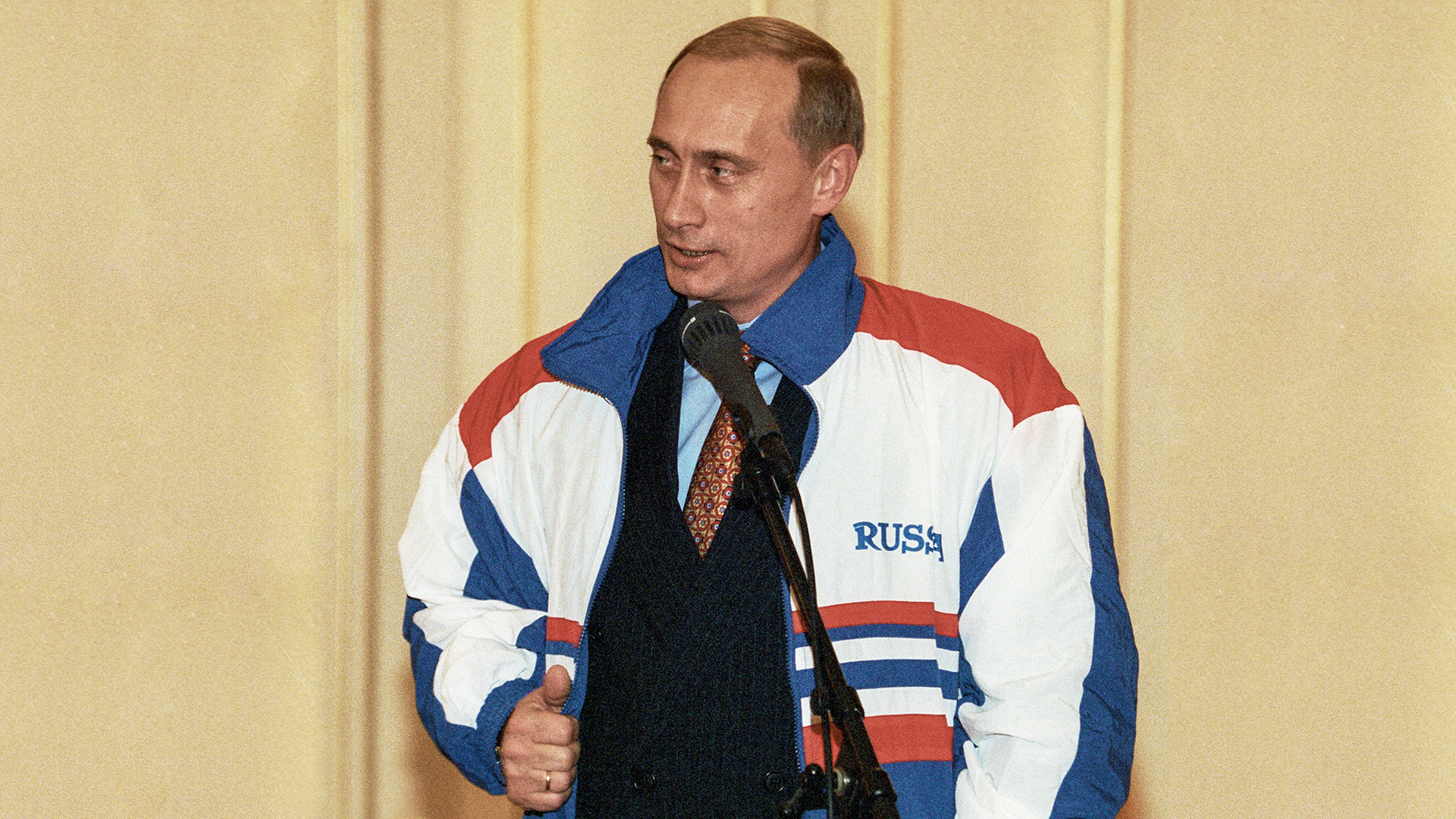 Russian Prime Minister Vladimir Putin speaks to athletes in front of the athletics team.