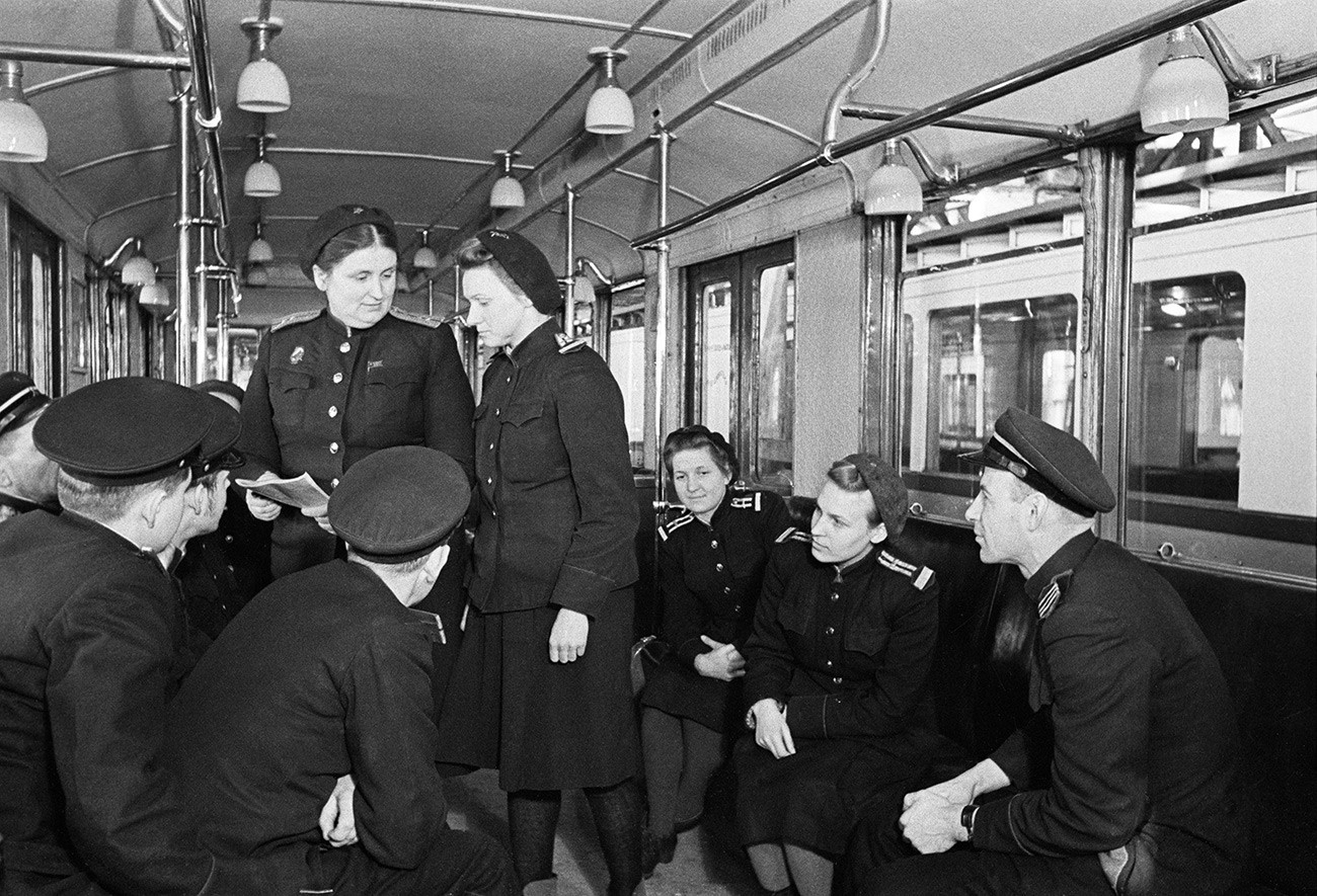 E. Mishina, standing, left, senior operator at the Severnoye maintenance facility of the Moscow Metro. 1949.