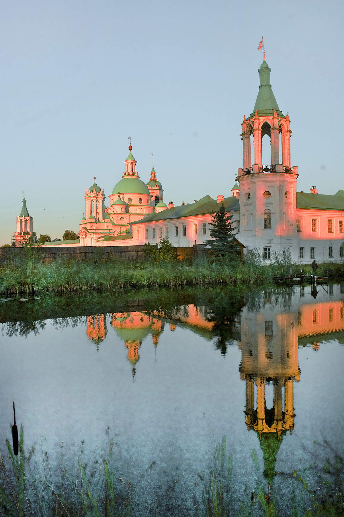 North wall, northwest view across monastery pond.  From left: Northeast corner tower, North Gate, Church of St. Dimitry of Rostov, cloisters & northwest corner tower. July 7, 2019. 