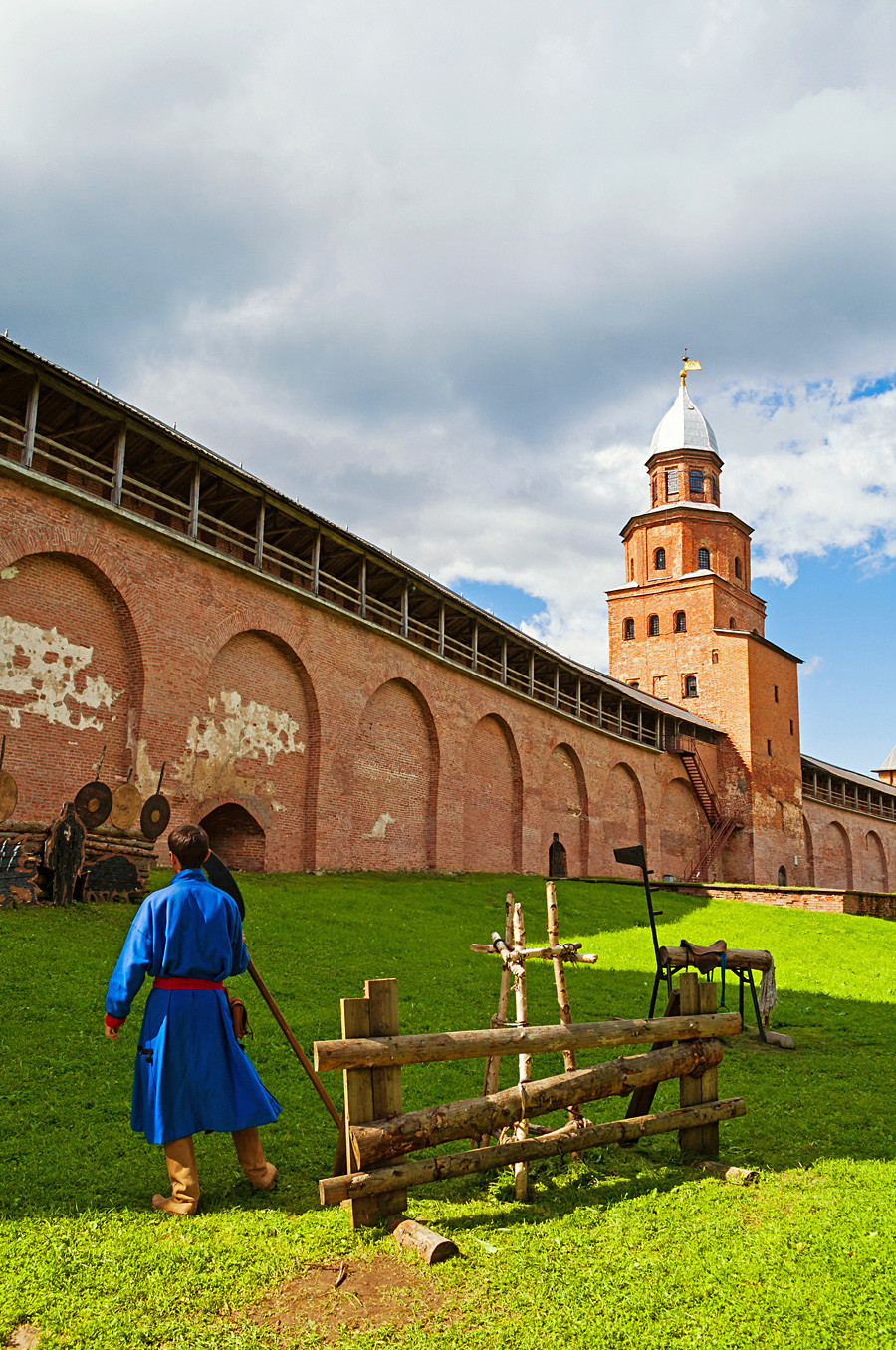 Kokui tower of Veliky Novgorod Kremlin and man dressed in medieval clothes in Veliky Novgorod, Russia.
