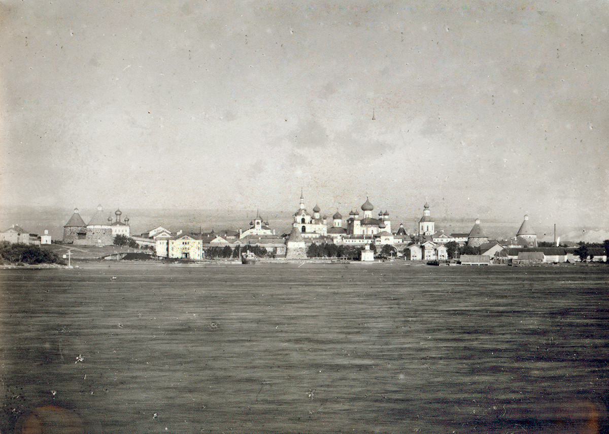 Transfiguration Monastery. West panorama across Solovetsky Bay. Center: Bell tower, Church of St. Nicholas, Transfiguration Cathedral. Left foreground: Preobrazhensky Hotel & dock.  Late summer 1916
