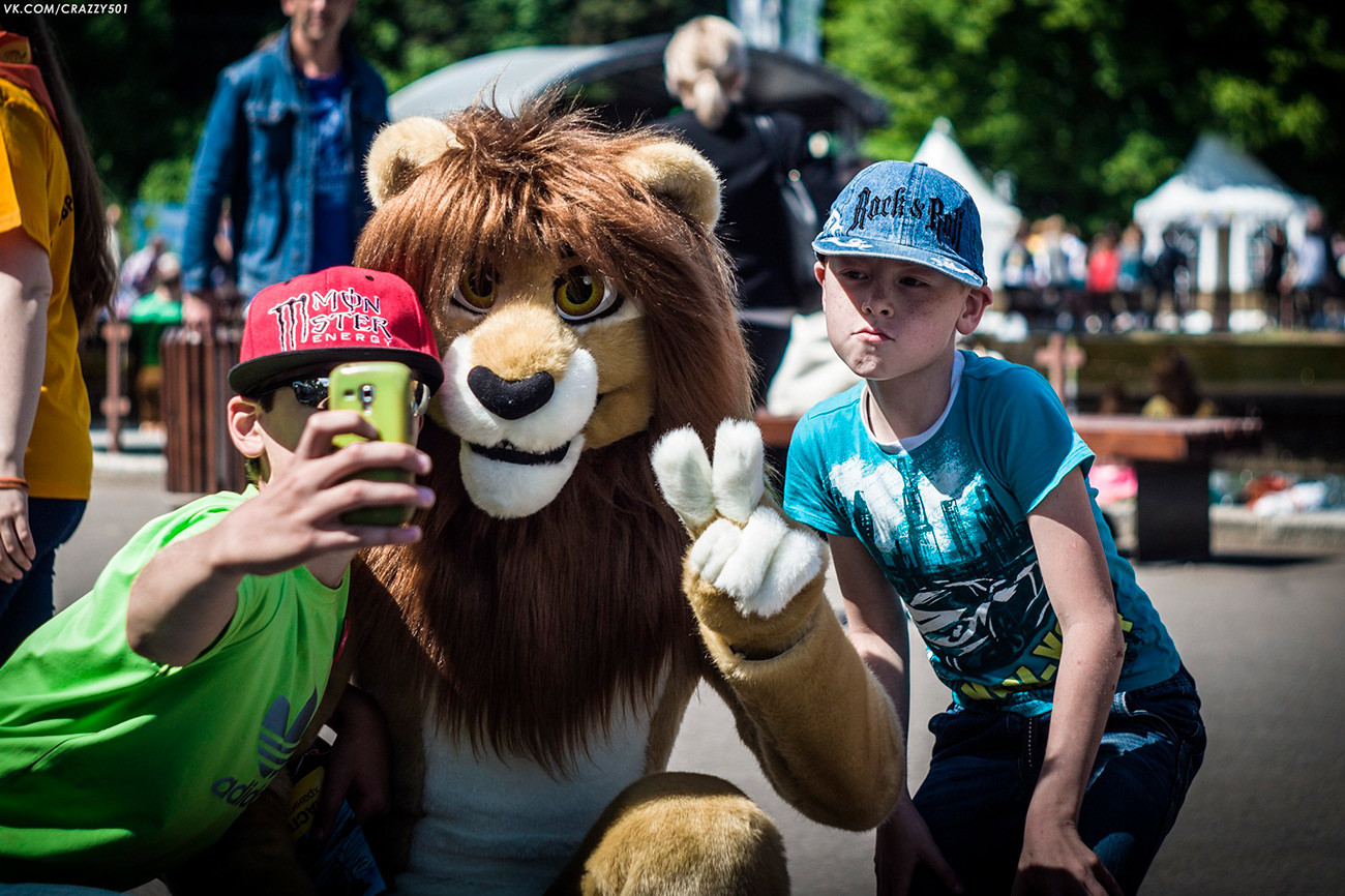 Moscow, Russia. 1st of September, 2020 Young girl wearing furry mask takes  part of annual meeting of fans of the hippie subculture in Tsaritsyno Park  of Moscow, Russia. Several dozen of people