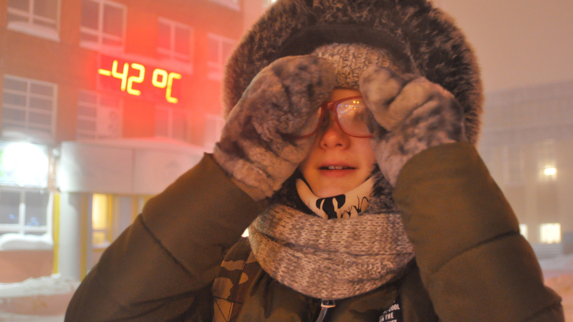 A girl is seen in a street at -42 degrees Celsius, Norilsk.