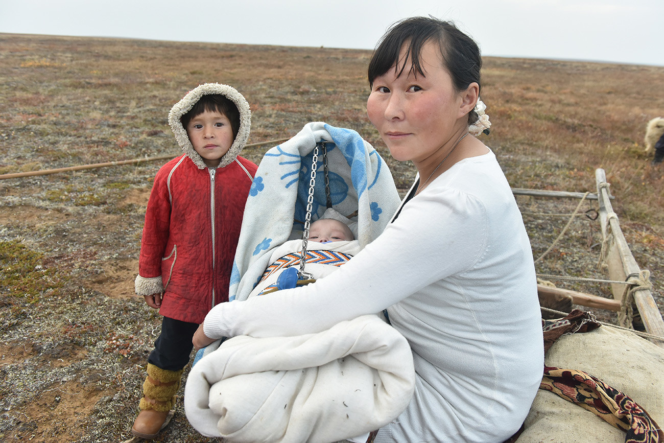 A Nenets woman with her children.