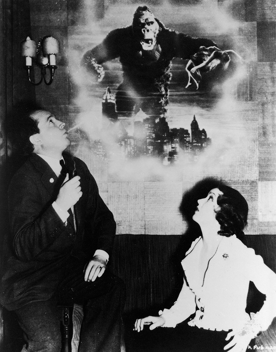 Publicity photograph shows Canadian actress Fay Wray as she listens to American movie director Merian Cooper who tells her the story of 'King Kong.'