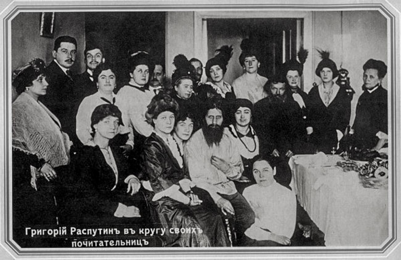 Rasputin and his admirers, 1914. His telephone can be seen on the right. This image has been widely reproduced in the press and various books since 1917.
