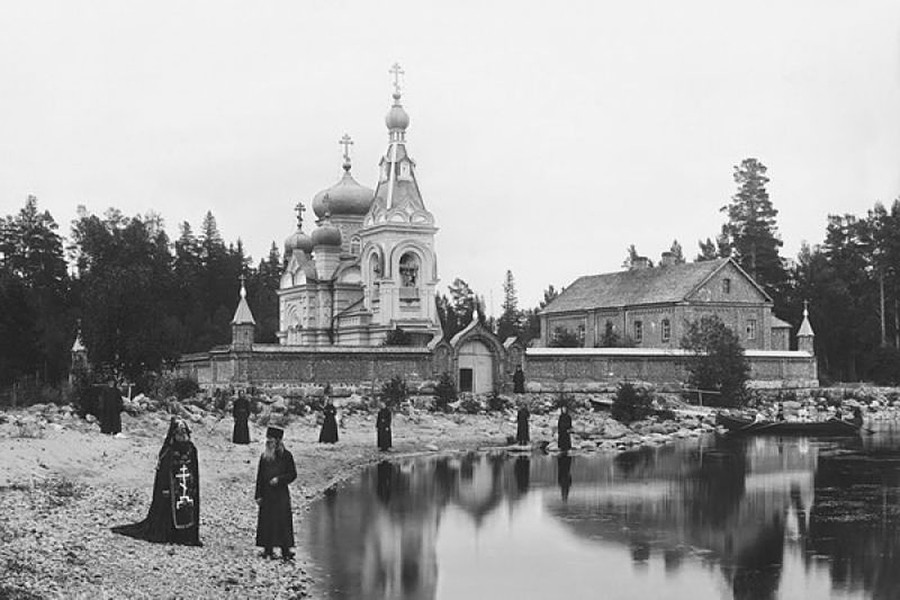 A group of monks and a schemnik at the Konevsky cell of the Konevsky Nativity monastery on the shore of Lake Ladoga, 1892