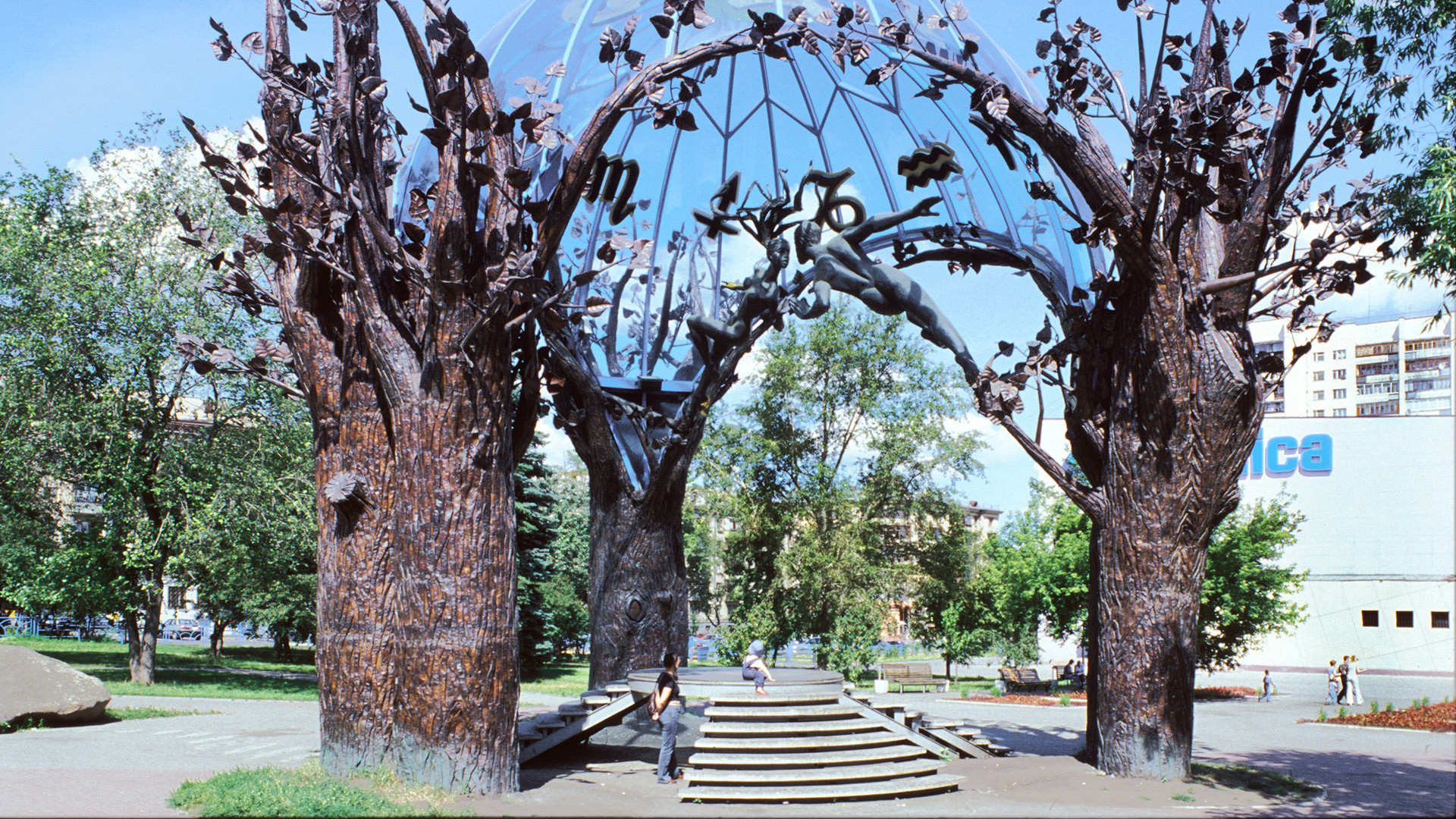 Chelyabinsk. "Sphere of Love," by Victor Mitroshin. Erected in 2000, this sculpture consists of four bronze trees surrounding two kissing figures under a dome of blue Italian glass. It has become the city's beloved calling card. July 13, 2003.