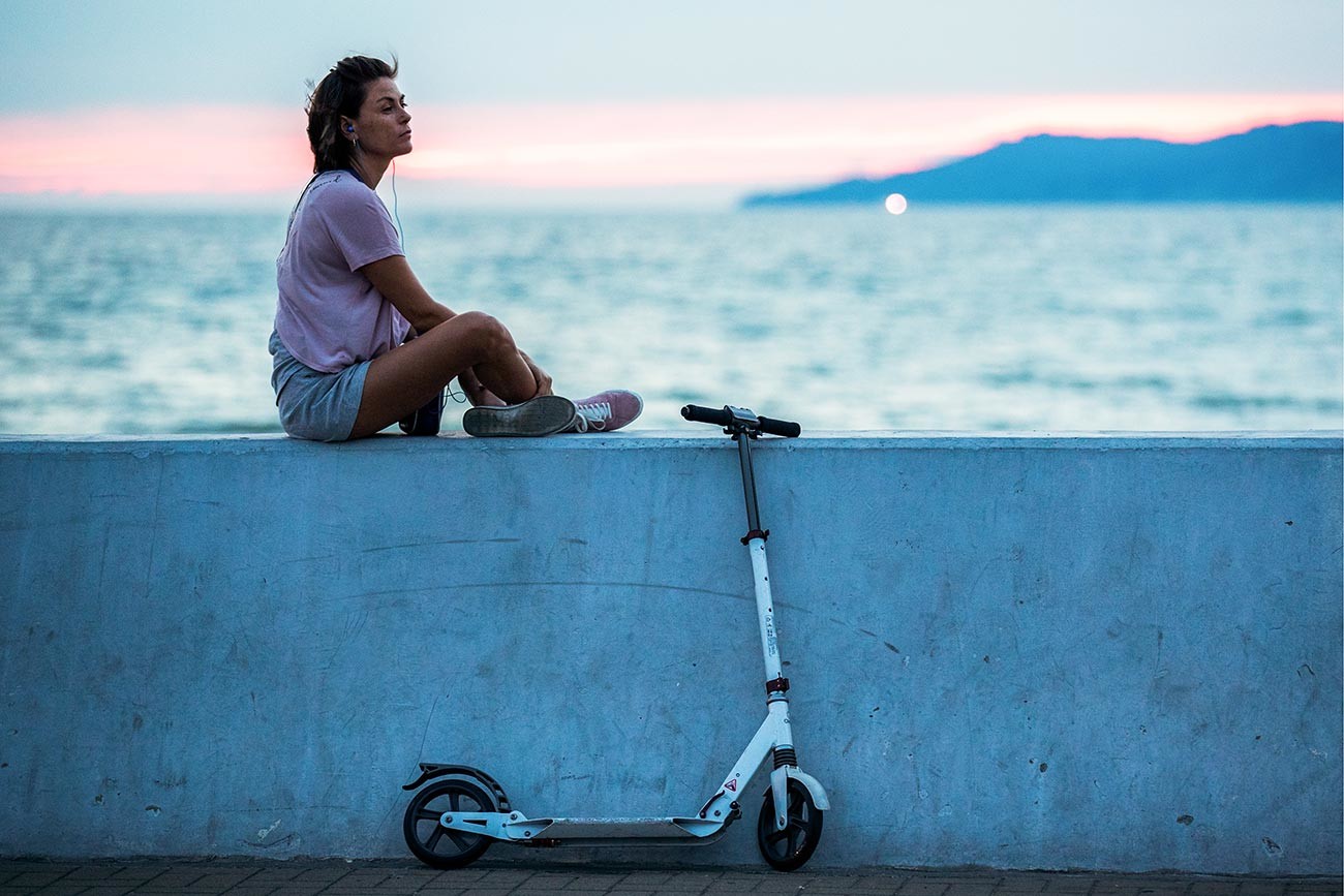 A girl watching the sunset in Sochi, Russia