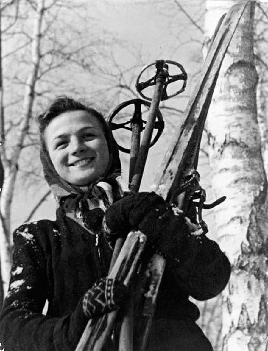 A female skier posing  